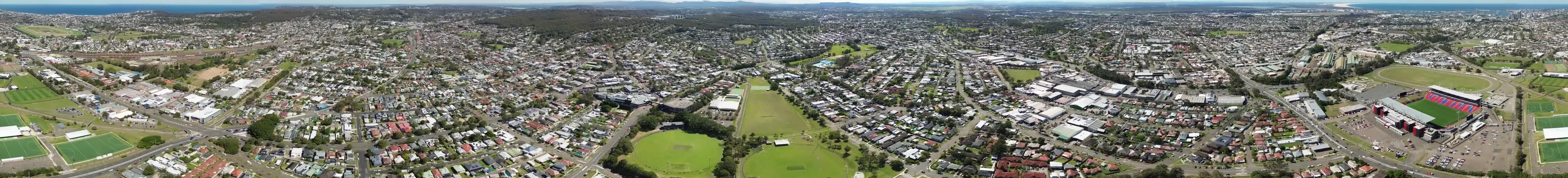 A full 360 degree aerial panorama around Ace Lane, taking in Lambton, New Lambton, McDonald Jones Stadium and the coast